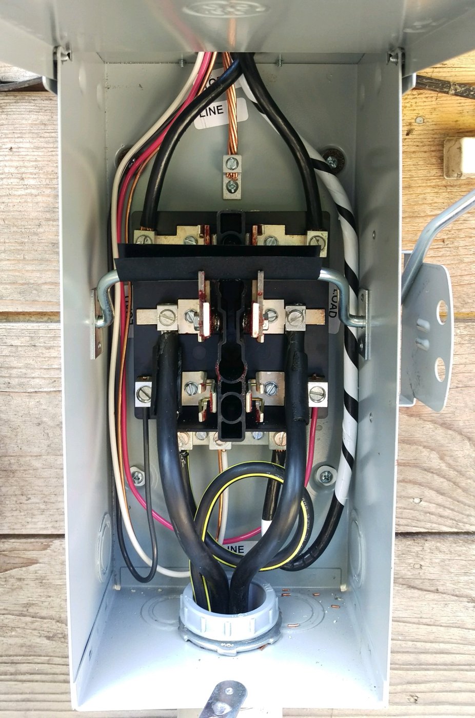 Wiring inside an electrical service disconnect by Draper Electric